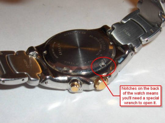 Watch with notches requiring a watch wrench